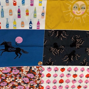 May include: A patchwork fabric featuring various printed squares including colorful soda bottles on white, a yellow sun, a black unicorn on blue, black octopuses on dark gray, pink and red strawberries, and floral patterns with pink flowers.