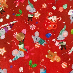Jingle Pals de Kathryn Selbert para Robert Kaufman. Se vende por media yarda. 100 % algodón. Navidad.