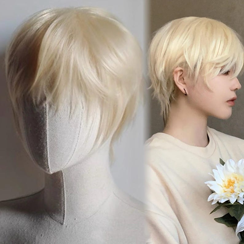 May include: A short, layered, light blonde wig with a natural-looking style. The wig is displayed on a mannequin head and also worn by a person. The hair has a slightly tousled appearance, with soft, textured layers.