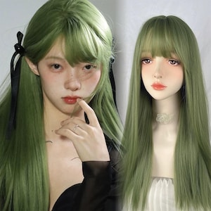 May include: Two images of a long, green wig with bangs. One image shows the wig on a person with black ribbons in their hair. The other image shows the wig on a mannequin. The wig is a vibrant shade of green.