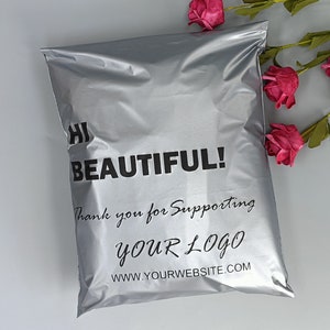 May include: Silver poly mailer with the text "Hi Beautiful! Thank you for supporting YOUR LOGO www.yourwebsite.com" printed in black.