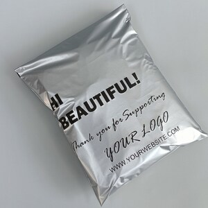 May include: Silver mailing envelope with the text "Hi Beautiful! Thank you for supporting YOUR LOGO www.yourwebsite.com"