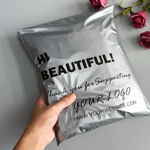 May include: Silver poly mailer with the text "Hi Beautiful! Thank you for supporting YOUR LOGO www.yourwebsite.com" printed on it.