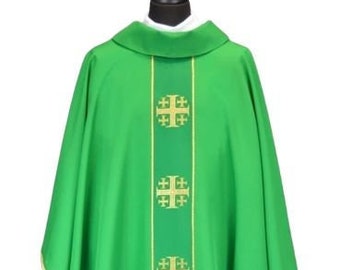 May include: Green liturgical chasuble with a gold embroidered design of a cross with four smaller crosses. The chasuble is worn by a priest during Mass.