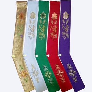 May include: Six different colored stoles with gold embroidery of wheat, grapes, and the letters "IHS".