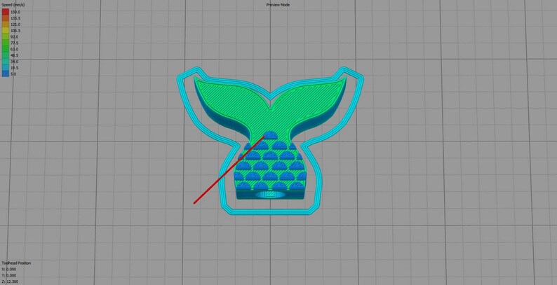 May include: A 3D printed mermaid tail cookie cutter with a teal blue outline and a green and blue tail. The tail has a scale pattern.