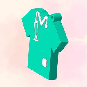 May include: A teal green scrub top with a white stethoscope and a white pocket. The scrub top is a 3D model and has a hole at the top for hanging.
