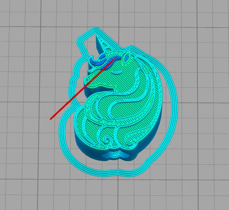 May include: A turquoise blue 3D printed unicorn cookie cutter with a detailed design. The unicorn has a horn, mane, and tail. The cookie cutter is ready to be used to create unicorn-shaped cookies.