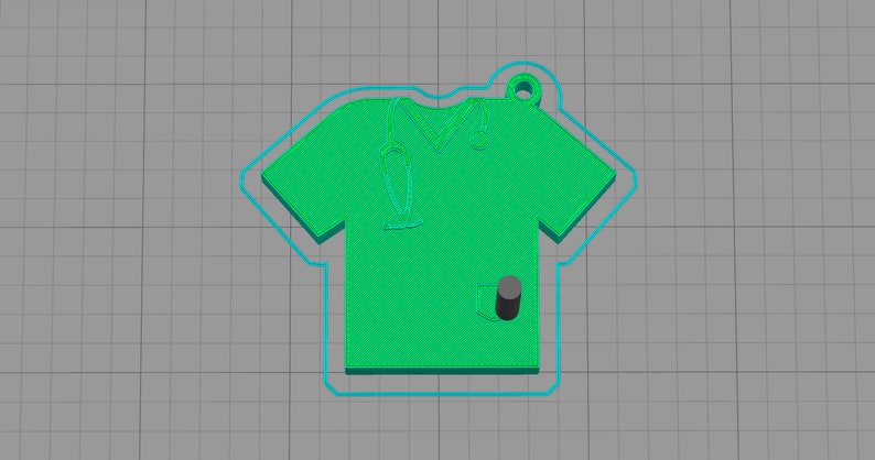 May include: Green scrub top keyring with a stethoscope and pocket. The keyring is made of plastic and has a hole for attaching to a key ring.