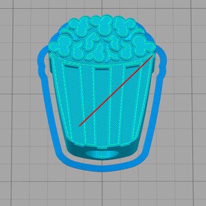 May include: A cyan-colored 3D-printed popcorn bucket with a handle. The popcorn kernels have a Mickey Mouse head shape. The bucket has vertical lines and a curved handle.