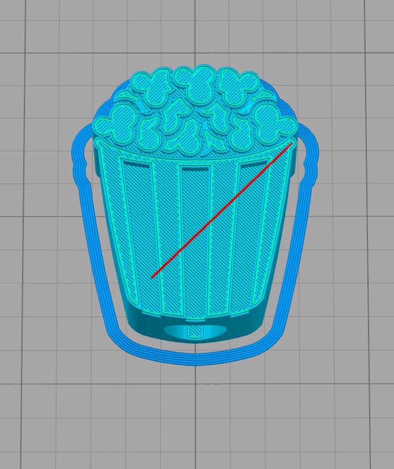 May include: A cyan-colored 3D-printed popcorn bucket with a handle. The popcorn kernels have a Mickey Mouse head shape. The bucket has vertical lines and a curved handle.