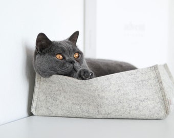 Felt cat bed made from sheep's wool. Cat sleeping place. Felt bed.