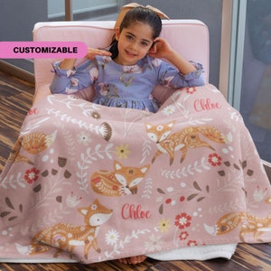 May include: A pink fleece blanket with a floral and fox pattern. The blanket is personalized with the name "Chloe".