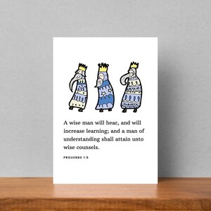 May include: A card with a quote from Proverbs 1:5, "A wise man will hear, and will increase learning; and a man of understanding shall attain unto wise counsels." The card features a cartoon illustration of three wise men in blue and yellow robes.