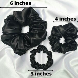 Black silky satin hair scrunchie approx sizes:
XL is 6 inches in diameter,
Medium is 4 inches in diameter
Skinny is 3 inches in diameter.
