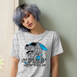 May include: A gray t-shirt with a robot dog graphic and the text "The more you care for me the happier I will be!"