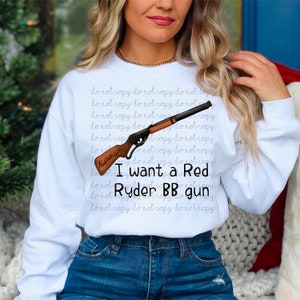 May include: A white sweatshirt with the text "I want a Red Ryder BB gun" and a cartoon image of a red toy gun. The text "do not copy" is repeated multiple times on the sweatshirt.