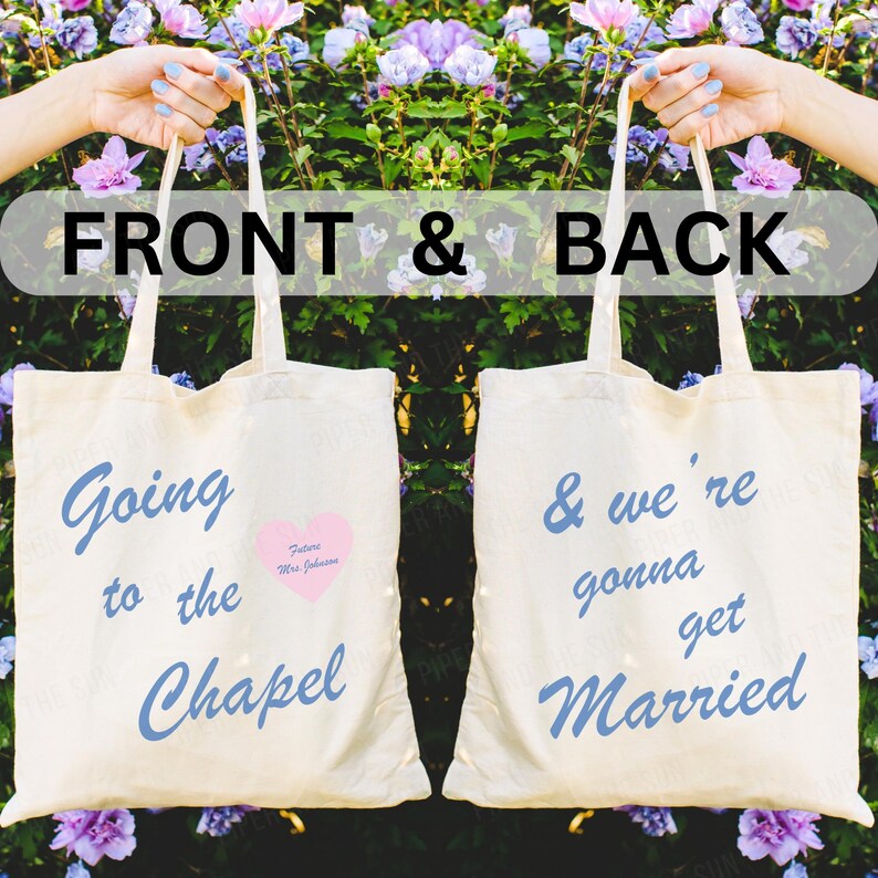 May include: Two white tote bags with blue text. The front bag says "Going to the Chapel" with a pink heart that says "Future Mrs. Johnson". The back bag says "& we're gonna get Married".