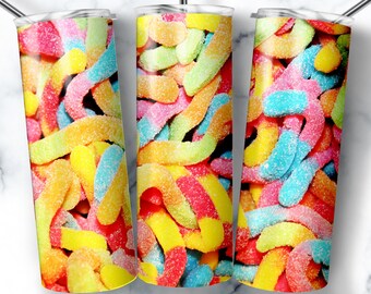 May include: Tumblers with a colorful gummy worm design. The design features a close-up of the candies in various colors, including red, yellow, green, and blue. The tumblers have a silver straw and a clear lid. The text "PORT WILDE TEMPLATE" is at the top.