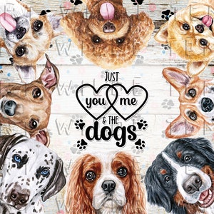 May include: A watercolor design featuring various dog breeds, including a Dalmatian, Cavalier King Charles Spaniel, and Bernese Mountain Dog. The phrase "Just you & me & the dogs" is centered, surrounded by paw prints and hearts, on a light wood-grain background.