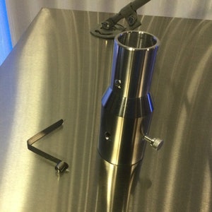 May include: A silver metal pole with a threaded knob on the side. A silver metal bracket is also included.