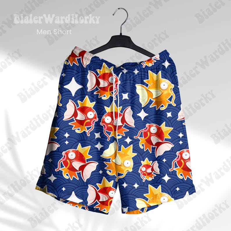 May include: Blue swim trunks with a repeating pattern of orange and yellow cartoon fish on a dark blue background.
