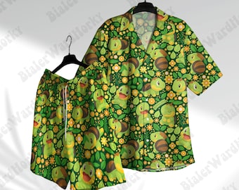 May include: Green button-up shirt and matching shorts set. The set features a repeating pattern of cartoon turtles, yellow flowers, and green leaves on a dark green background. The shorts have a white drawstring.