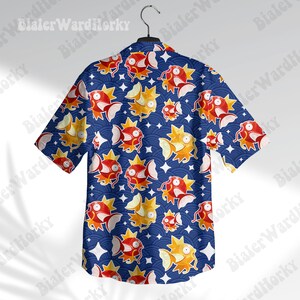 May include: A blue short-sleeved button-up shirt with a repeating pattern of red and orange fish and stars.
