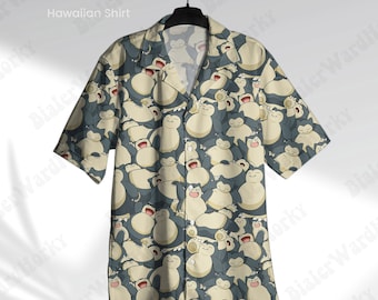 May include: A beige Hawaiian shirt with a short sleeve design featuring a repeating pattern of cartoon Snorlax Pokemon characters. The shirt has a button-up front and a collared neckline.