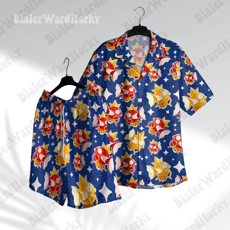 May include: A blue and orange patterned short-sleeved shirt and matching shorts. The pattern features a repeating design of a red and orange creature with a star-like shape.