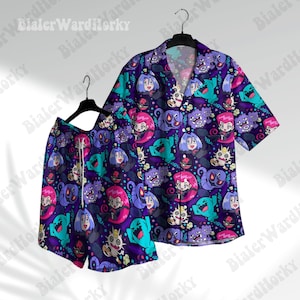 May include: A matching purple short-sleeve button-down shirt and shorts set. The set features a repeating pattern of cartoon characters in teal, pink, and white on a dark purple background. The shirt has a v-neck collar and the shorts have a drawstring.