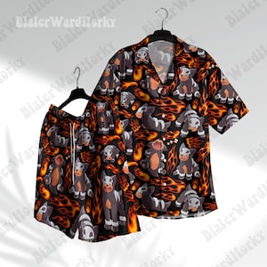 May include: A matching black button-down shirt and shorts set. The set features a repeating pattern of a cartoon dog character with flames. The shirt has a collar and short sleeves. The shorts have a drawstring. The background is black.