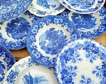 4 mismatched plates in shades of transferware blue from various sources for a tour of Europe