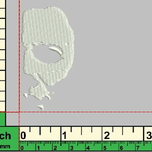 May include: White embroidered patch of a face with a hole for an eye. The patch is approximately 1.5 inches tall and 1 inch wide.