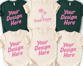 May include: A collection of six short-sleeved t-shirts arranged in two rows. Four shirts are cream-colored and two are dark green. The shirts feature the pink text Your Design Here, while one cream shirt displays a pink palm tree graphic and Pink Palm.