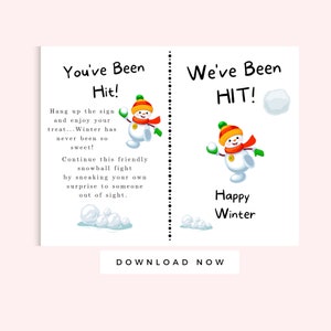 May include: A printable sign with a snowman throwing a snowball. The sign says "You've Been Hit!" and "We've Been HIT!" with the text "Happy Winter" below the snowman.