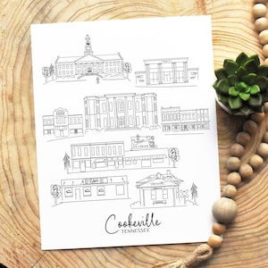 May include: A black and white line drawing illustration of Cookeville, Tennessee. The illustration features several buildings, including a courthouse, a school, a church, and a few shops. The text "Cookeville, Tennessee" is written at the bottom of the illustration.