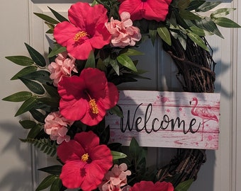 Gorgeous Fuschia Hibiscus Welcome Wreath on an oval grapevine base. Perfect to keep up all Spring and Summer!