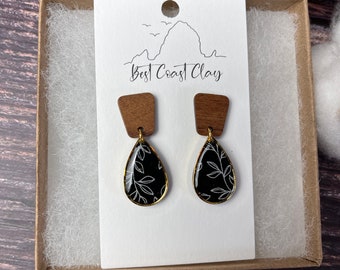 The Remi l Black gold dangle polymer clay earrings with walnut studs