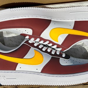 maroon and gold nike shoes