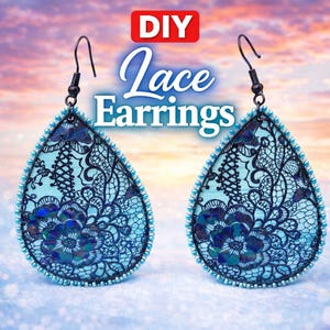 May include: Pair of teardrop-shaped lace earrings. The earrings feature a light blue background with intricate dark blue lace patterns and floral accents. The edges are trimmed with small blue beads, and the hooks are black. The image includes the text "DIY Lace Earrings".