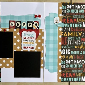 May include: A scrapbook layout with a polka dot background, featuring the word "HAPPY" and the phrase "ALWAYS BELIEVE SOMETHING WONDERFUL IS ABOUT TO HAPPEN." Decorative elements include a cassette tape and various word art designs.