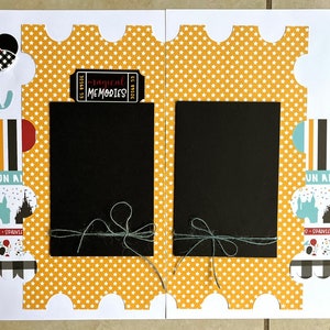 May include: A scrapbook layout with a Disney theme. It features a black Mickey Mouse silhouette with a bow, the word "dream", and several photo spaces. Decorative elements include a camera, ticket, and star accents.