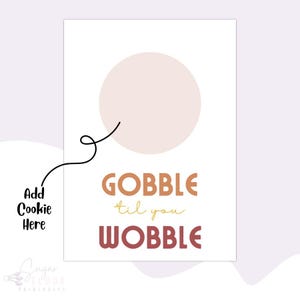 May include: A printable Thanksgiving-themed sign with a circle for a cookie. The sign says "Gobble til you Wobble" in a retro font with orange, red, and yellow colors.