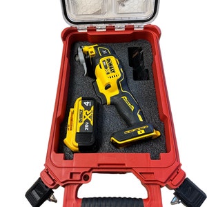 May include: A red tool case with a black handle and latches. The case is open and contains a yellow and black DeWalt XR 20V MAX cordless oscillating tool and a yellow and black DeWalt XR 20V MAX battery.