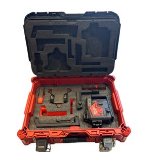May include: A red hard case with a black foam interior holds a black and red laser level. The laser level has a Milwaukee logo and the text "Self-Leveling Cross-Line Laser" on it.