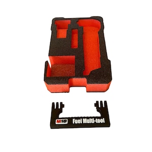 May include: A black foam case with red interior cutouts for a tool. The case has a black handle with the text "M18 Fuel Multi-tool" printed on it.