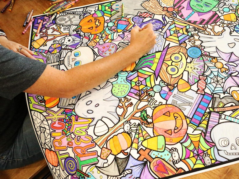May include: A large colouring page featuring a variety of Halloween-themed illustrations. The page is filled with colourful images of pumpkins, ghosts, bats, candy corn, and other spooky characters. The page is partially coloured in with bright colours, including orange, yellow, green, and purple.