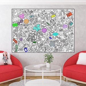 May include: A white wall with a large black and white doodle art print featuring various symbols and objects. The print is surrounded by two red armchairs with white pillows and a glass coffee table with a book on top. A small doll is sitting on one of the armchairs.