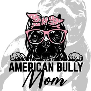 May include: A black American Bully dog wearing pink sunglasses and a pink polka dot headband. The dog is looking at the camera and has its paws on a white surface. The text "AMERICAN BULLY MOM" is written below the dog.
